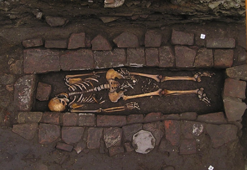 The grim burial scene.